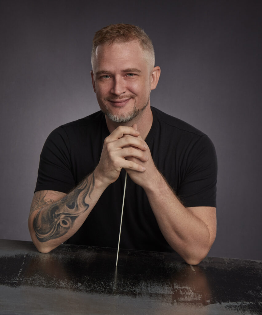 Conductor James Welsch in black tee